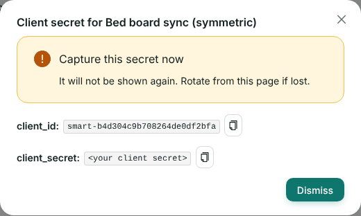 A dialog titled Client secret for Bed board sync, warning Capture this secret now, with the client_id and a hidden client_secret, each with a copy button